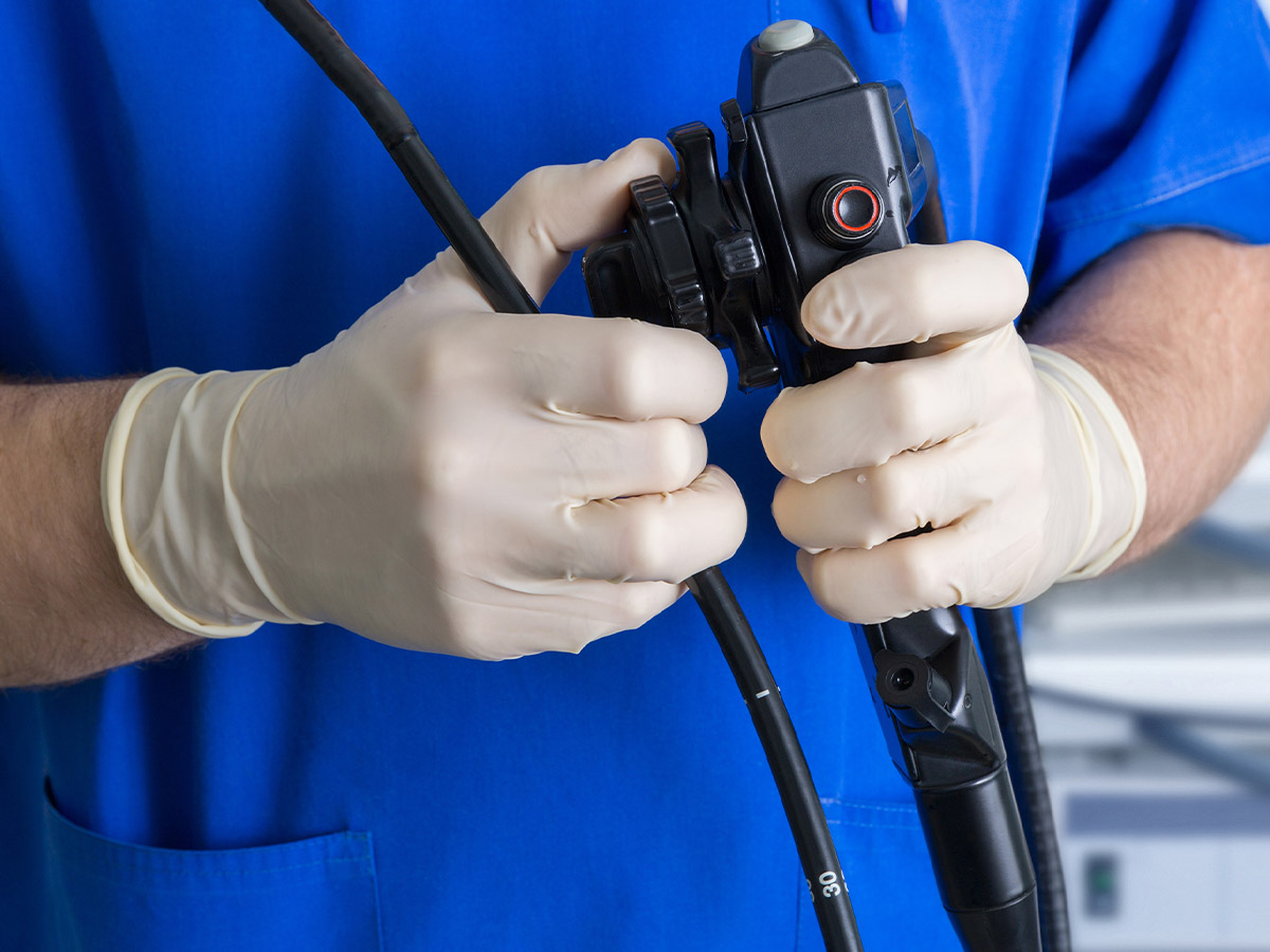 a doctor holding an endoscopy device