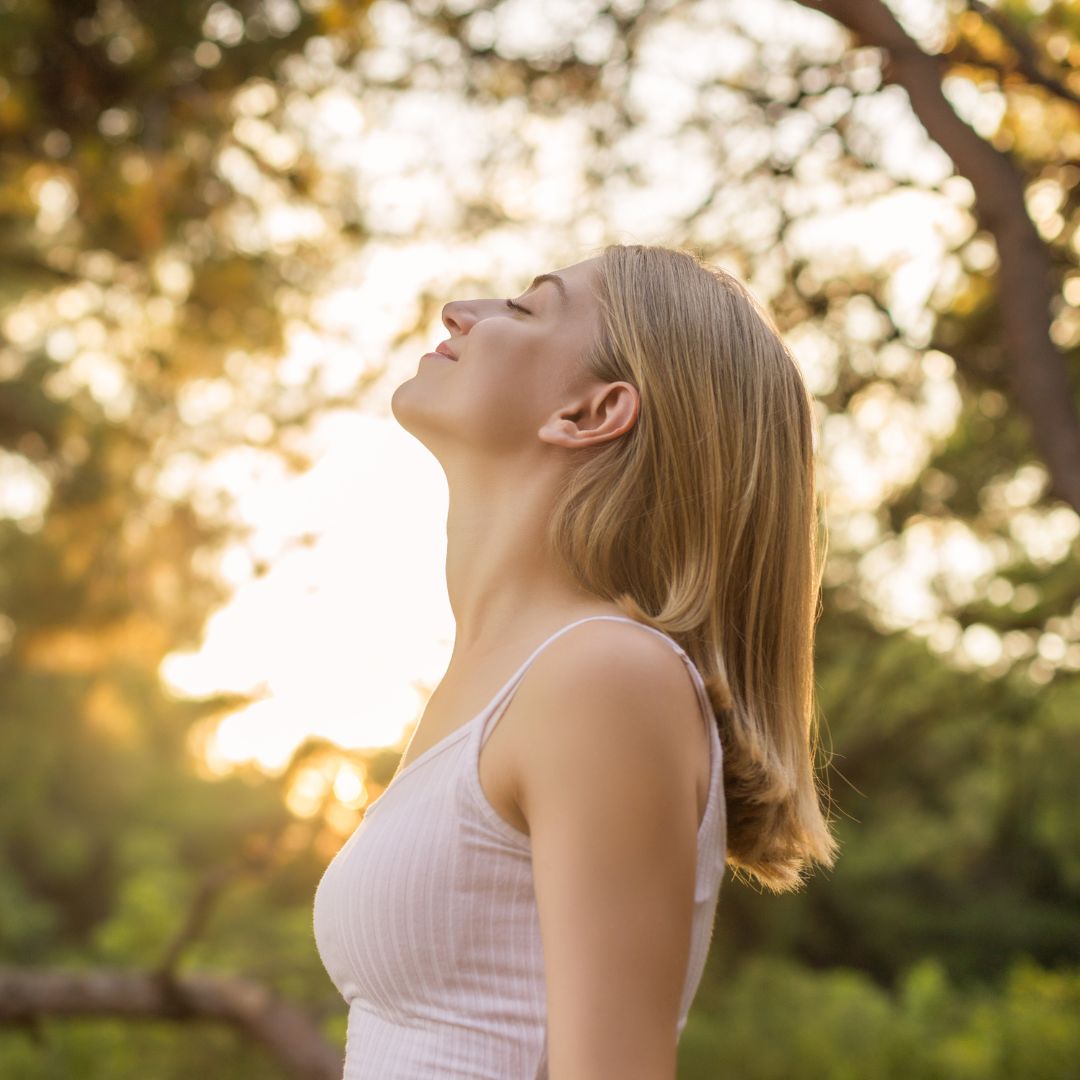 woman taking a deep breath