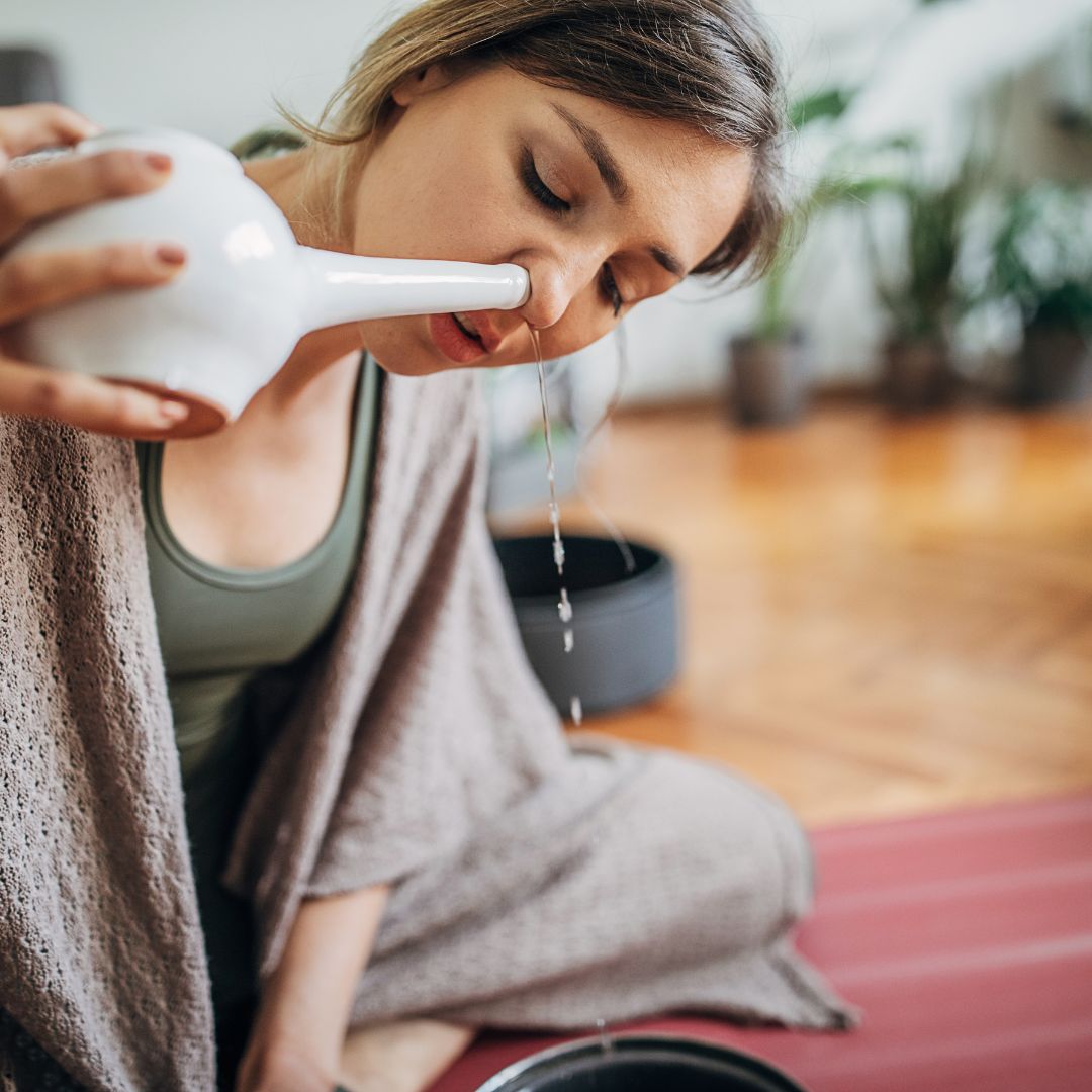 woman using a neti pot