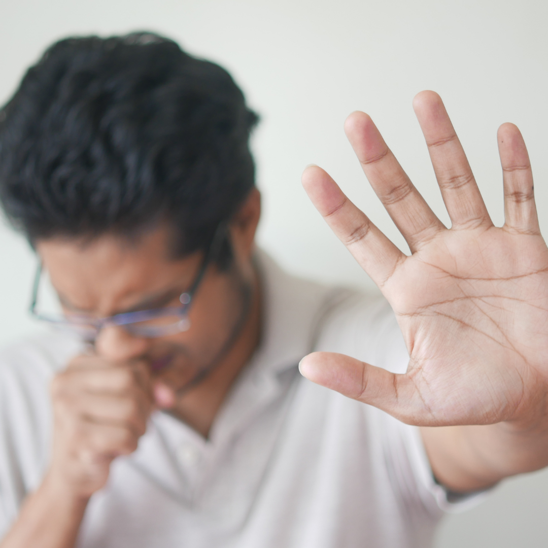 coughing with hand out